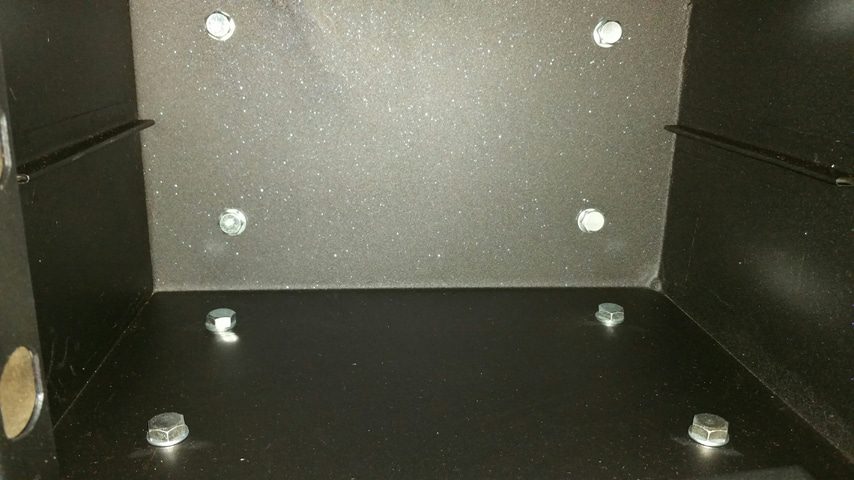 four fixing holes in the base and four fixing holes in the rear of the safe